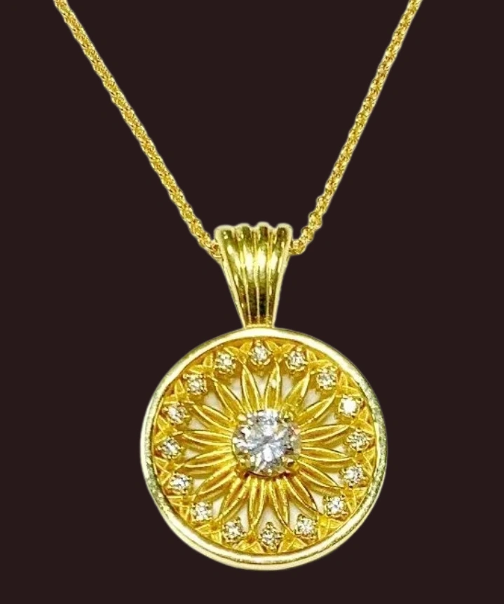 This beautiful diamond circle necklace is made of 18 karat yellow gold and has been designed by Mich