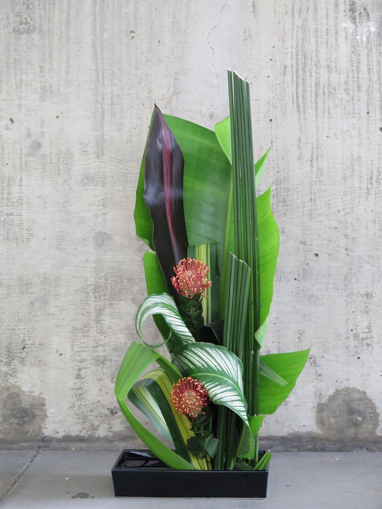 Ikebana arrangement using mostly green elements. 