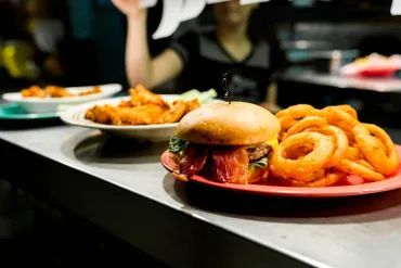 closeup shot of the burger and rings 