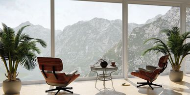 Cozy room with mountain view and two lounge chairs.