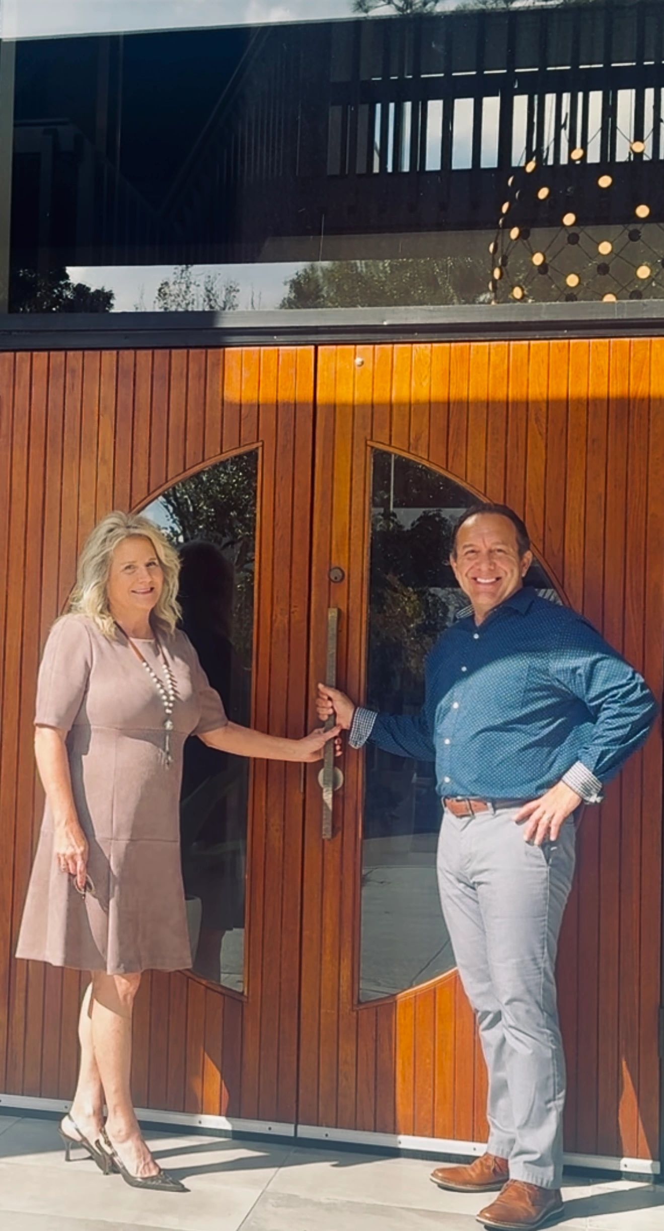 Dr. Vince Giovinco Chiropractor and Gloria at the entrance to Advanced Chiropractic of Jacksonville.