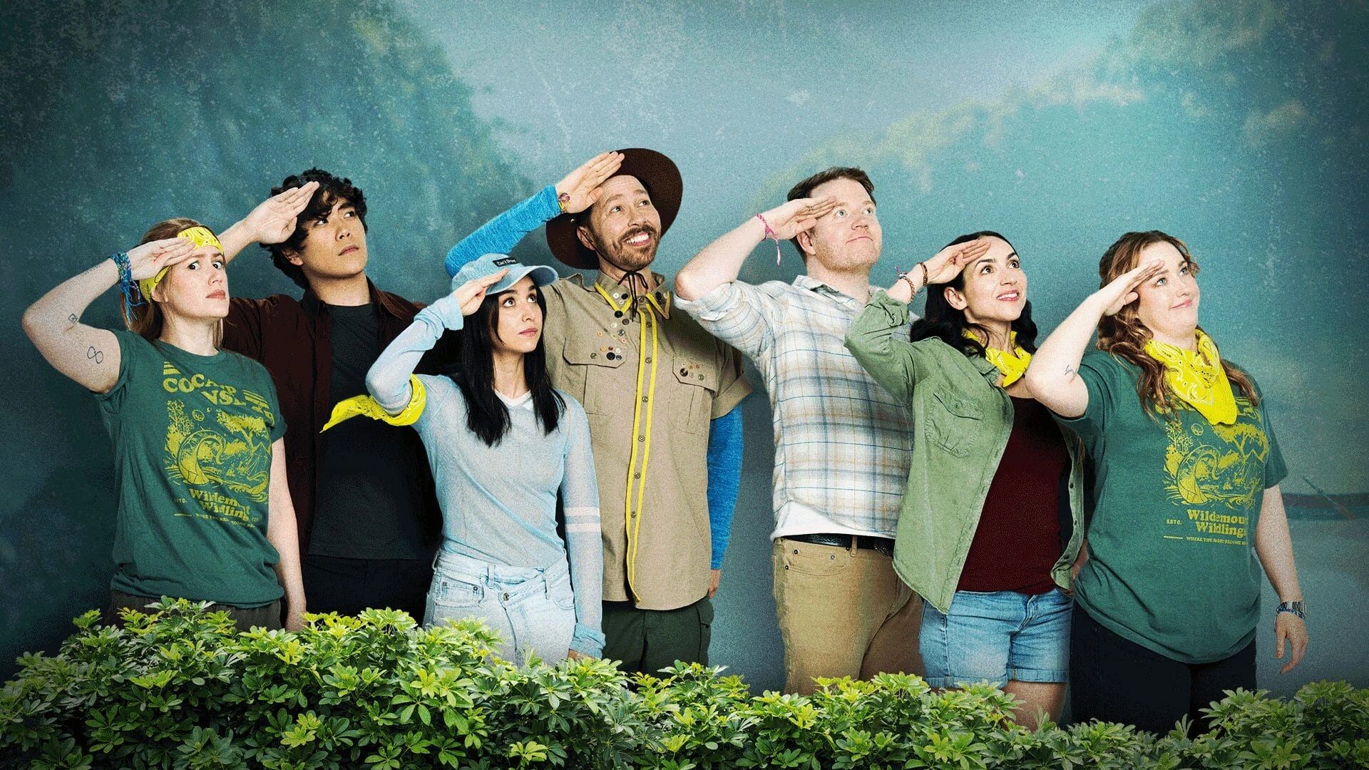 Six people standing in a line, saluting with cheerful expressions.