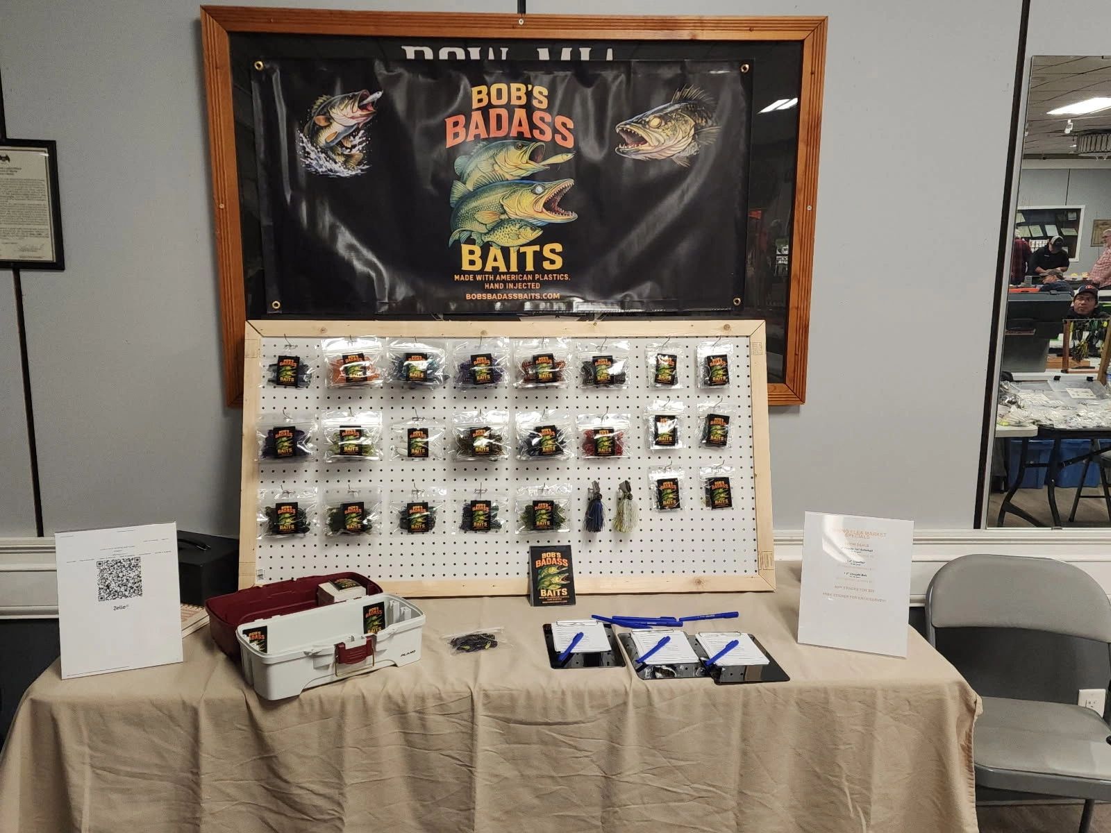 Display booth showcasing Bob's Badass Baits fishing lures and products.
