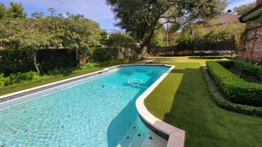 Beautiful pool with fake grass installed