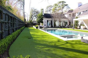 Large backyard with artificial turf