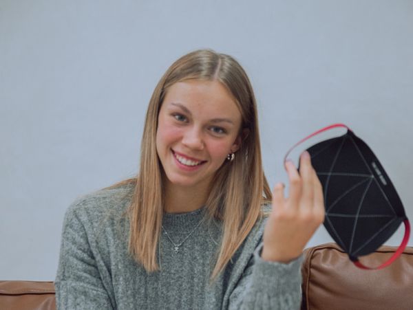 Girl holding The Card Buddy