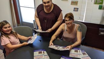 Volunteers helping hand out literature.