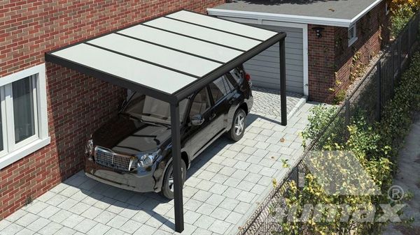 Black SUV parked under a modern carport attached to a brick house.