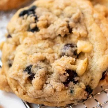 Close-up of a chocolate chip cookie with a crumbly topping.