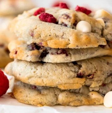Stack of white chocolate chip and raspberry cookies.