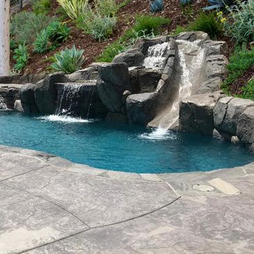 Rock waterwall grotto slide rockwork pool builder near me custom inland empire riverside temecula