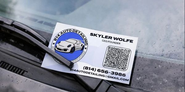 Business card for Skyler Wolfe's auto detailing service on a car windshield.