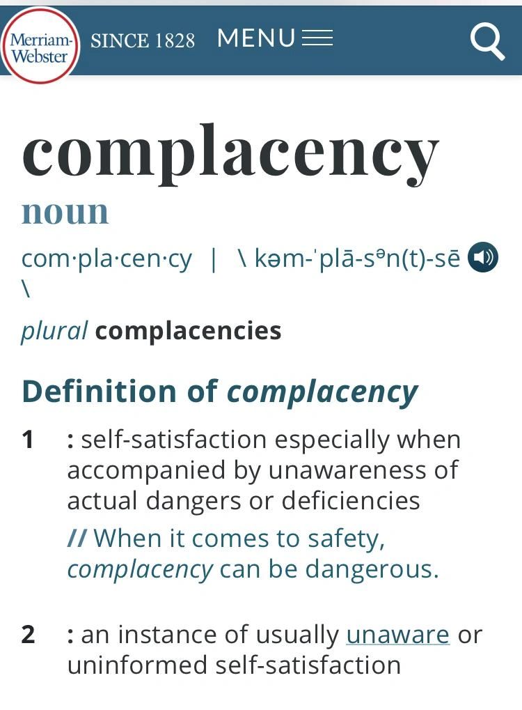 complacent definition