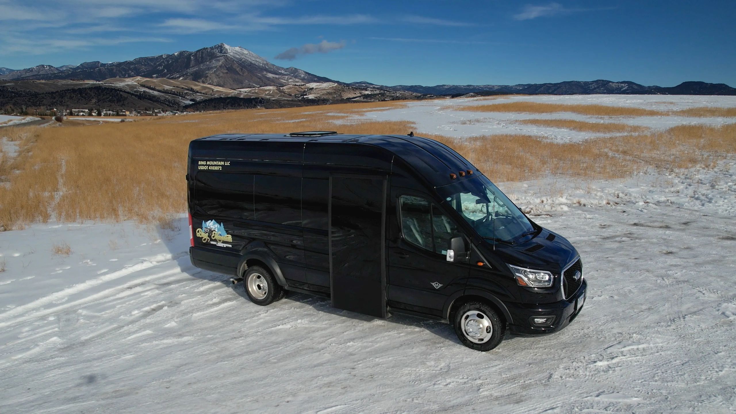 Bing Mountain luxury executive van parked in Montana winter landscape