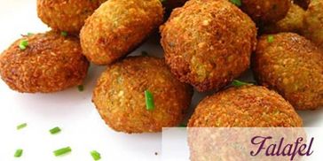 Crispy falafel balls garnished with fresh parsley on a white background.
