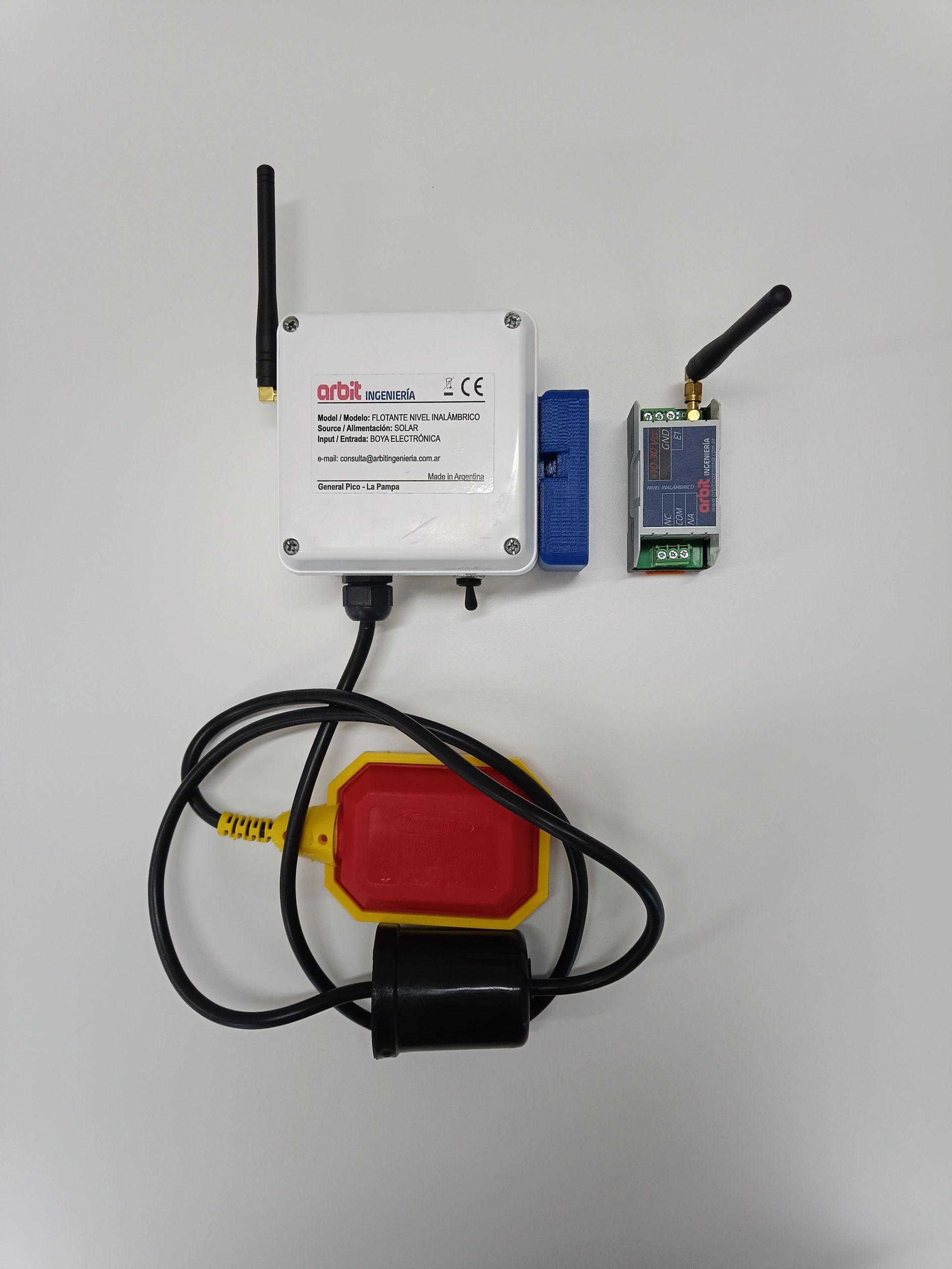 Wireless solar-powered float level sensor system with antennas and connected cables.