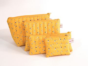 Organize beautifully with this handmade travel pouch set in coordinated sizes.