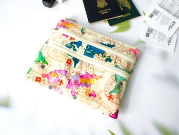 Colorful world map pouch with passports and boarding passes.