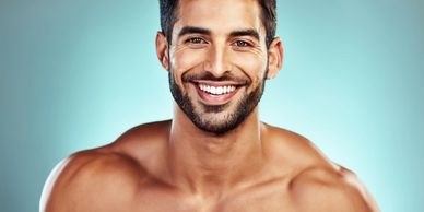 Handsome young man shirtless smiling 