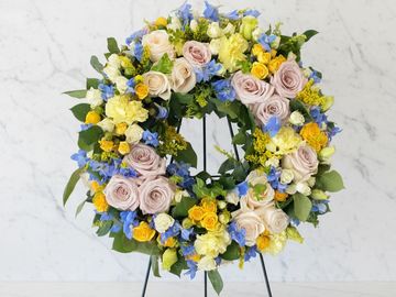 Memorialize your loved one with a beautiful and tastefully adorned wreath, available in colors of yo