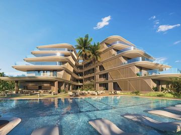 Modern architectural building with curved balconies and a large pool.