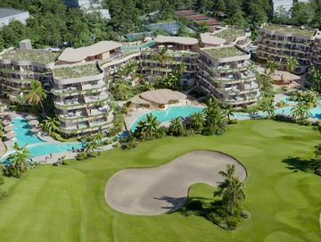 Luxury resort with green golf course and multiple pools.