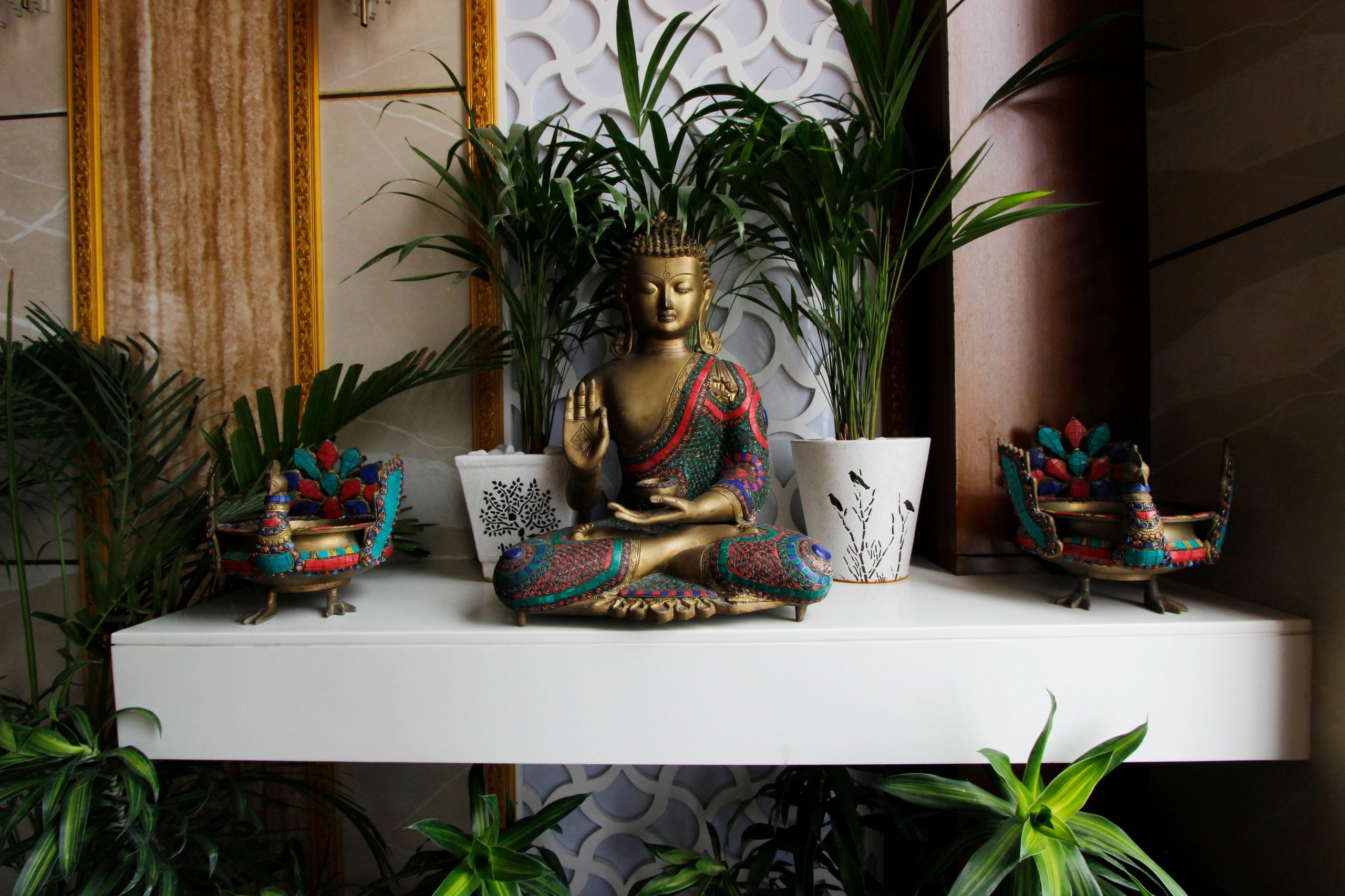 Brass Budha statue at the Foyer as an element of Interior Design 