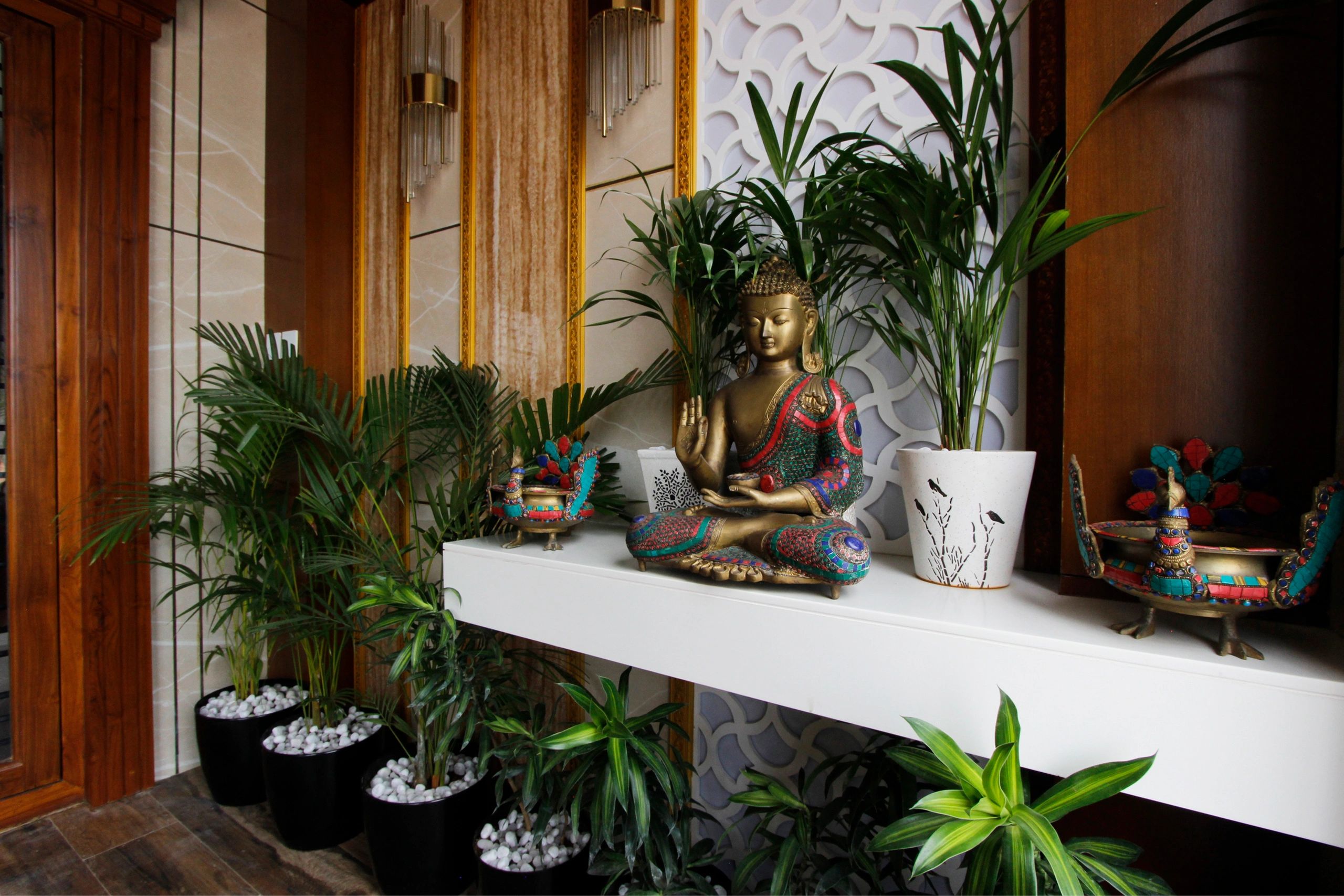 Brass Budha statue at the Foyer as an element of Interior Design 
