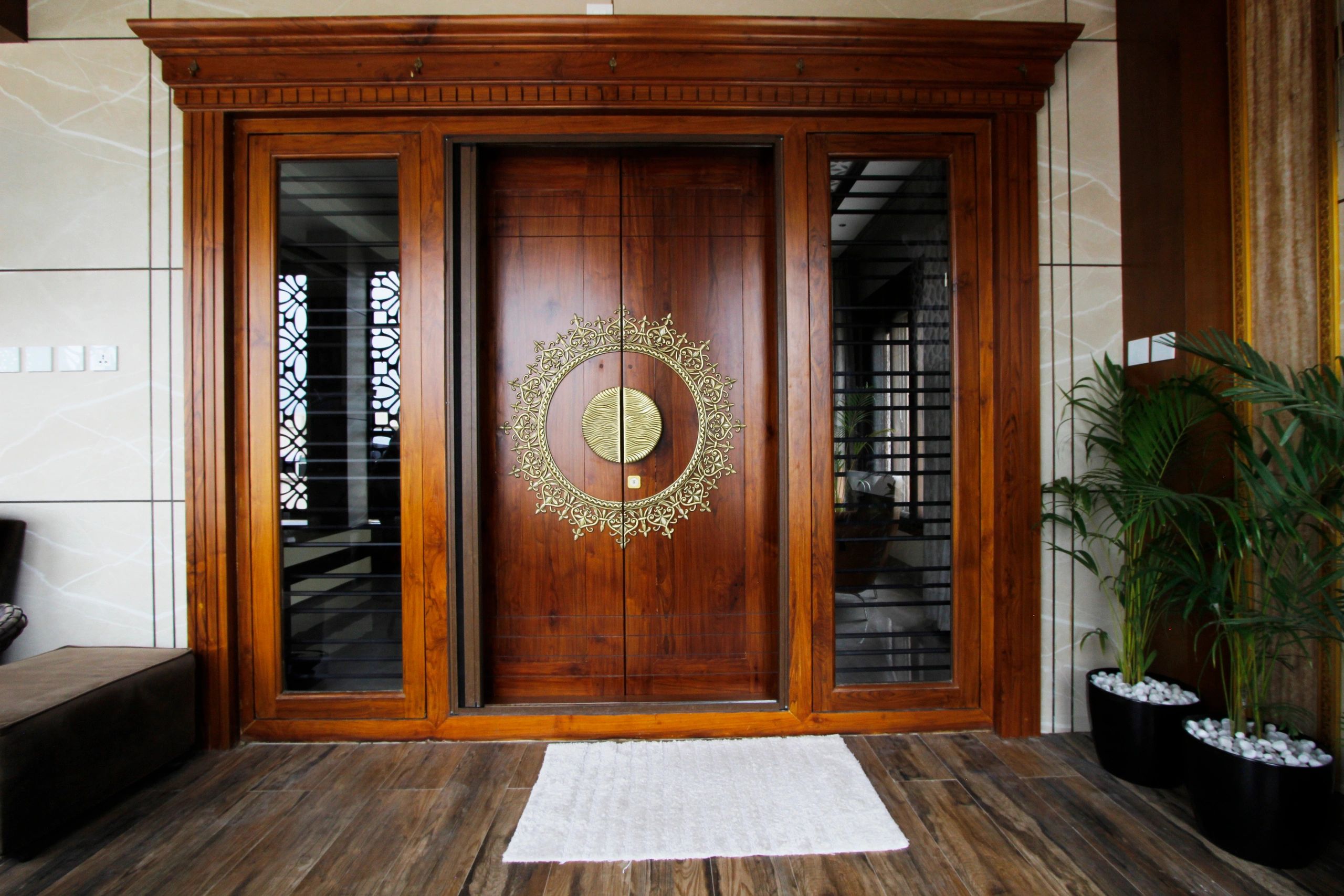 Main entry door with brass embellishments and handles