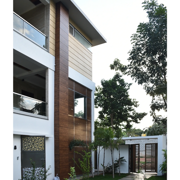 Exterior Facade with Fundermax cladding with stepping stones on pathway