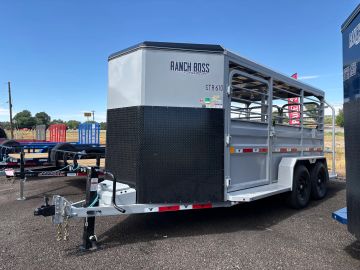 White Ranch Boss livestock trailer parked outdoors.