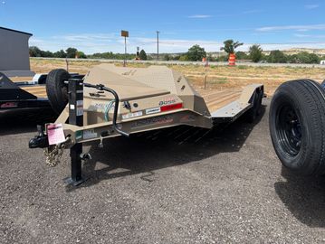 Flatbed trailer parked on asphalt.