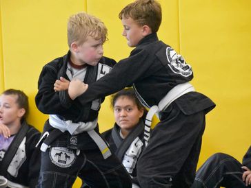Children grappling in Brazilian Jiu Jitsu class