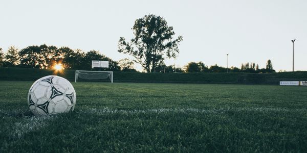 The team has gone home, but the soccer ball is ready for the next day's training.