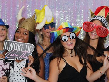 Group of people wearing fun props for a photo booth rental in Scottsdale