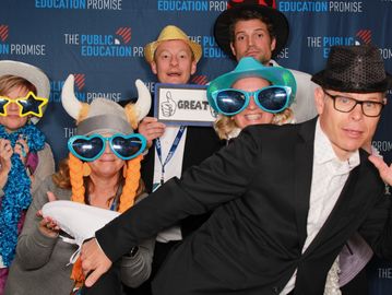 Group of people at a Phoenix Conference laughing in a photo booth
