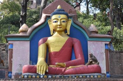 Buddha on the steps to the monkey temple, Swayambhunath, Kathmandu, Nepal