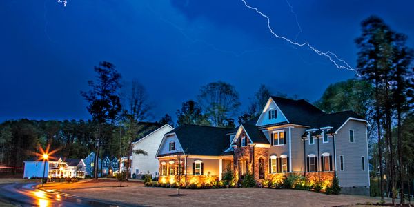 Powerful lightning storm front passes over homes with whole home generators