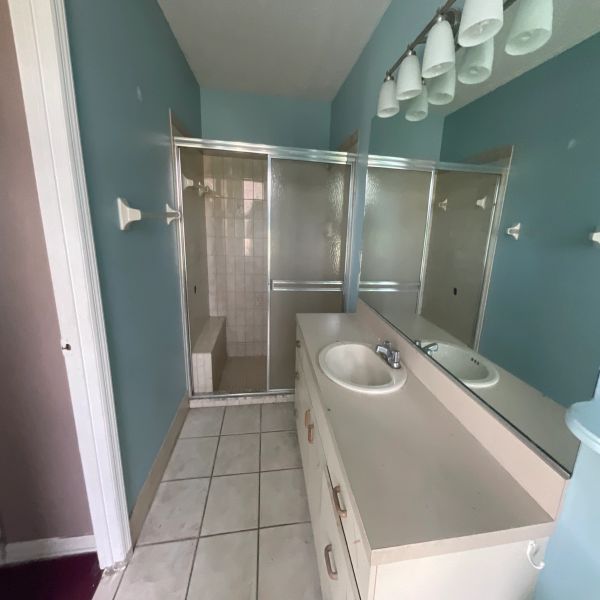 Full bathroom remodel, interior painting, flooring repair, shower tile removal, and new tile installation. Repair of leaking sink