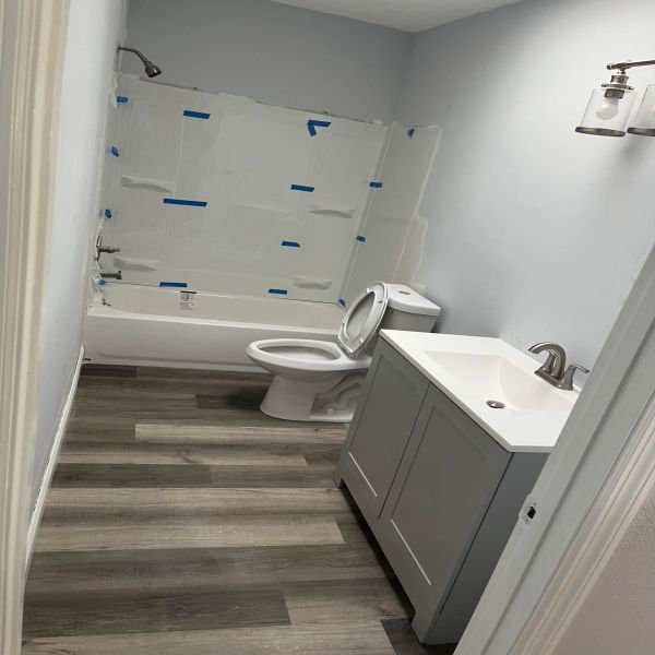Bathroom remodel, vinyl flooring, shower tiling, full bathroom demolition, and electrical outlet repairs