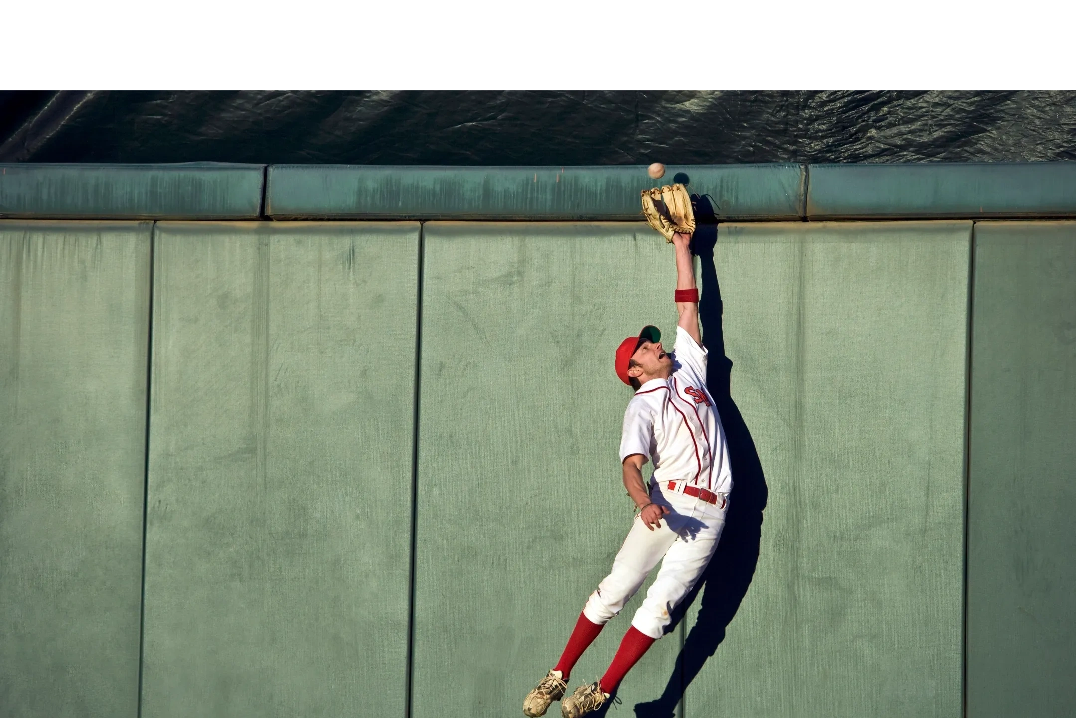 Baseball Player Reaching for a Ball