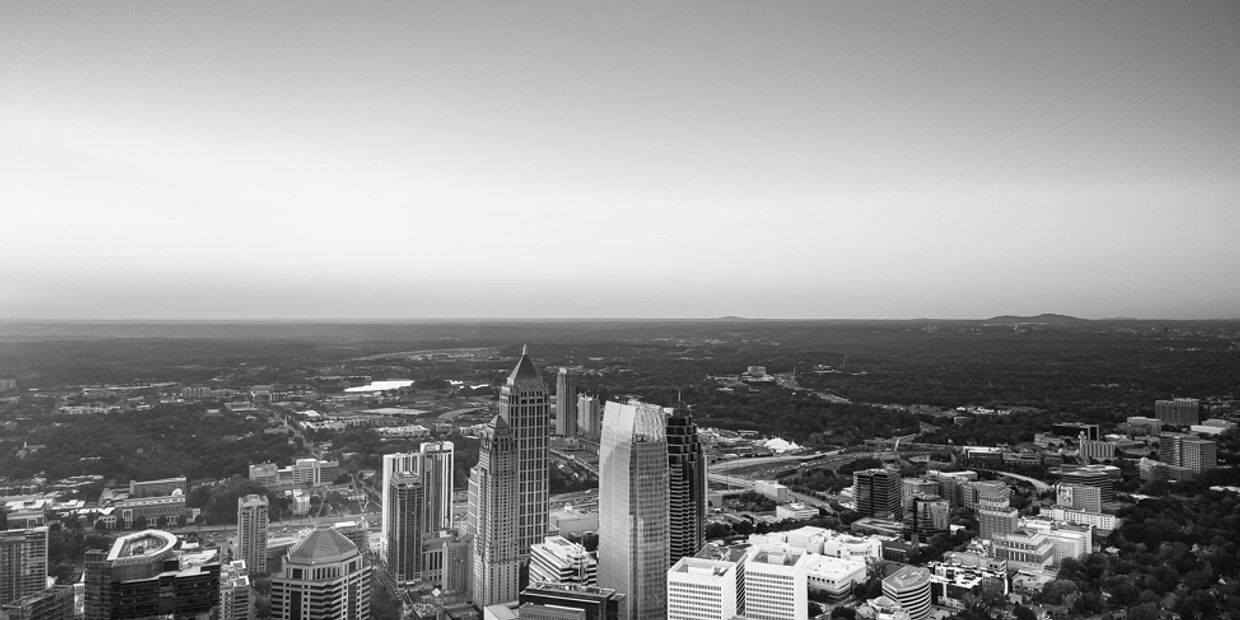 Overhead image of the downtown Atlanta Skyline with office buildings and healthcare offices.