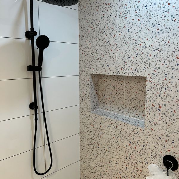 black rain head shower head with hand held.