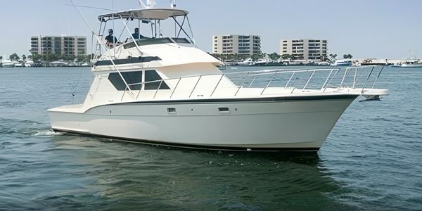 White fishing boat on water.
