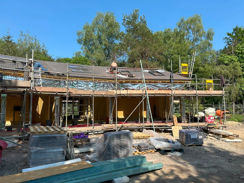 Roofing almost complete on timber frame house