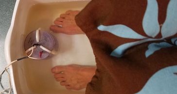 Photo of woman getting Aqua Chi foot detox