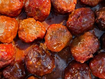 Juicy handmade smoked meatballs drenched in our signature BBQ sauce,