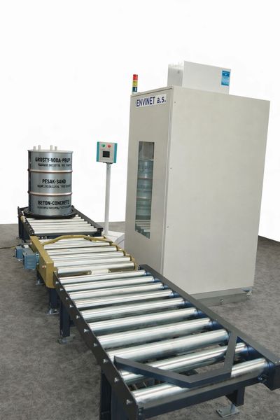 Automated conveyor system with labeled barrels.