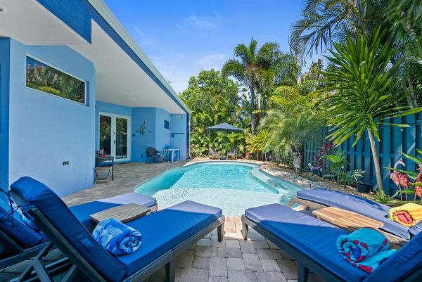 Heated pool at Fantasy Island Inn in Wilton Manor, Florida. A top rated mens only bed and breakfast