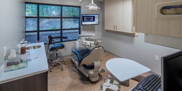 Midmark Elevance chair and equipment in a treatment room of dental office with med-gas.
